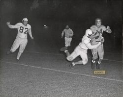 Run play during Petaluma Leghorn game against Santa Rosa Bonecrushers