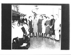 Group of people in the switchboard area of the telephone company, Petaluma, California, 1949