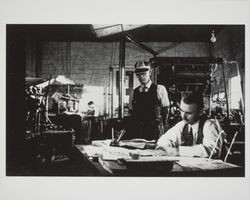 Unidentified printer employee and foreman at an unidentified printing company, 1940s or 1950s