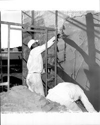 Applying Calaveras Plastic to exterior of the Santa Rosa Garden Apartments