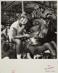 Taking a carousel ride at the Sonoma County Fair, Santa Rosa, California, 1981