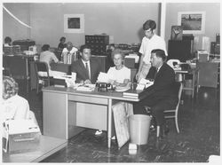 Unidentified businessmen and secretaries in a Sonoma County office, 1960s