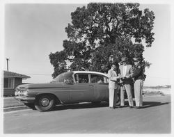 Dutch Flohr and two others standing near a City of Santa Rosa car, Santa Rosa, California, 1959