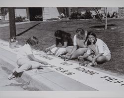 Girls paint a sign for the 9th Annual Old Adobe Festival, Petaluma, California, 1960s