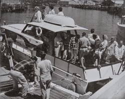 Group on passengers aboard the yacht "Tizmyne" on the Petaluma River, Petaluma, California, 1950s