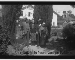 Unidentified relatives standing in front yard of the Nissen family home at 629 Baker Street, Petaluma, California, about 1935