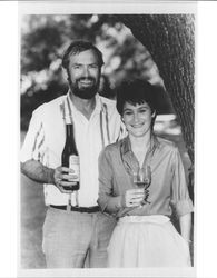 Bill and Sandy MacIver of Matanzas Creek Winery standing with their prize winning Chardonnay, Santa Rosa, California, about 1983