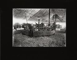 View of exhibit area of 1915 Apple Show circular exhibit with star made from apples in the foreground