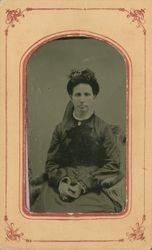 Portrait of an unidentified woman sitting in a chair