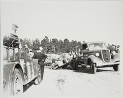 T.M. Jones Towing pulling the wreckage of the Bacci Drug Store racing car