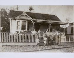 Josephine P. Girolo and her children standing in front of their home in Santa Rosa, California, 1910