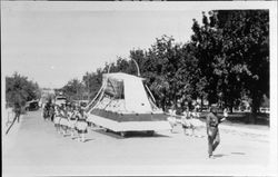 Petaluma egg basket held by women holding streamers, Petaluma, California, about 1923