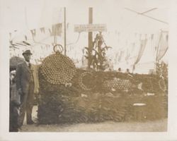 Man standing by an Apple Show exhibit