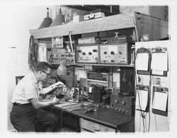 Technician at a workbench in M. L. Bruner Company, Santa Rosa, California, 1964