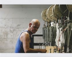 Harold Allen by a braiding machine, Sunset Line & Twine, Petaluma, California, Dec. 2006