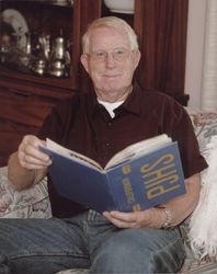 Portrait of Leonard M. Svinth with a Petaluma Junior High Yearbook, Petaluma, California, 2010