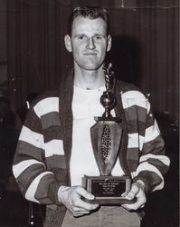 Harvey Balestrini with his wrist wrestling trophy, Petaluma, California, 1967