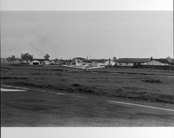 Planes on the ground and in the air at Sky Ranch, Petaluma, California, 1978