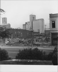 Tearing down buildings on North Petaluma Boulevard, across from Hill Park, Petaluma, California, 1959