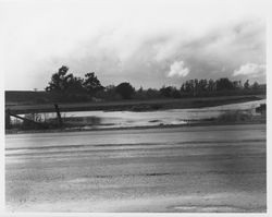 Flooded construction area between Petaluma Boulevard North and Highway 101 in southern Sonoma County, 1950s or 1960s