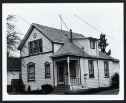 Decorated two story Greek Revival farm house with Stick Style detailing