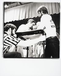 Two contestants arm wrestle on the Petaluma Veterans Memorial Auditorium stage at the 1978 World’s Wristwrestling Championship, Petaluma, California, 1978