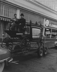 Arthur Parent and unidentified man on a horse drawn hearse., Petaluma, California, 1956