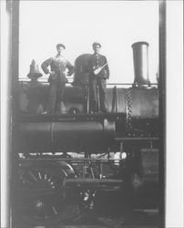 Railroad workers standing on a Northwest Pacific engine, Petaluma?, California, about 1914