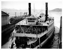 Passengers crowding the deck of the ferry Alameda, Oakland, California, about 1939