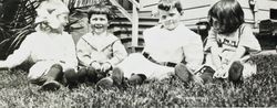 Wilfred Everett Bixby, Jr. and three unidentified friends at the Bixby house, 415 Perkins Street, Oakland, California, about 1912