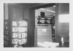 Book display rack and danger sign in the crumbling Santa Rosa, California Carnegie Library, 1960