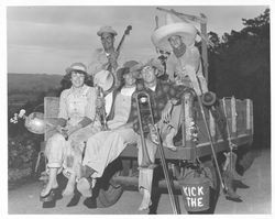 Band members dressed as farmers sitting in a wagon, Petaluma, California, about 1950