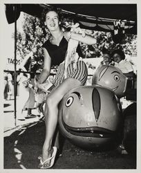 Mrs. Thomson takes a ride at the Sonoma County Fair Carnival, Santa Rosa, California