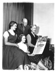 Four people looking at a Leghorns 1954 schedule, Petaluma, California