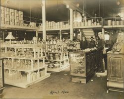 A. F. Tomasini standing inside his hardware store in Petaluma, California along with four other unidentified men, 1922