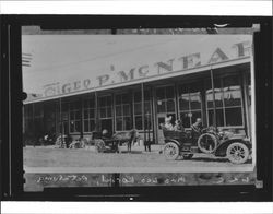 Mrs. Leo Korbel in her car parked in front of McNear's, Petaluma, California, 1913