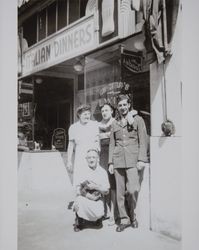 Cinceras and friends stand in front of Cincera's Restaurant, photographed between 1941 and 1946