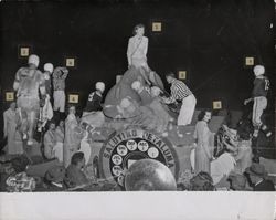 Double exposure photograph of Petaluma Leghorns superimposed with the Brandeburg Telephone Company Float