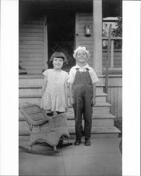 Eileen Medley and her brother Lincoln "Neil" Medley pose for a photograph in front of the family home at 231 Wilson Street, Petaluma, California, about 1926