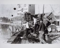 Chief of the Petaluma Fire Department with Petaluma's 1924 fire truck, Petaluma, California, photographed between 1951 and 1955