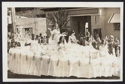 Apple Blossom Queen and her court on a float