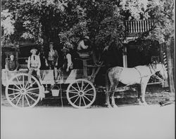 Men in wagon in front of United States Hotel, Cloverdale, California, 1905