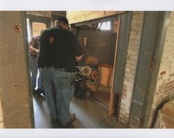 Big Dennis Henderson taking a box of reels off the elevator at Sunset Line & Twine Company in Petaluma, California, Dec. 2006