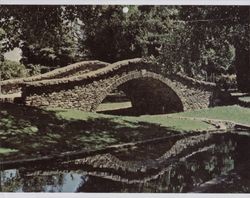 Stone bridge over a waterway in Juilliard Park, Juilliard Park, Santa Rosa, California, in the 1930s