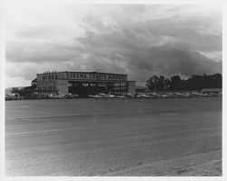 Sonoma County Airport terminal building with sign, "Let's fly Piper," mounted on left side, 1973