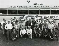 Members of the American Breeder Service standing in front of a bus at the ABS Global headquarters in DeForest, Wisconsin