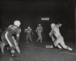 Run play during Petaluma Leghorn game against the Presidio