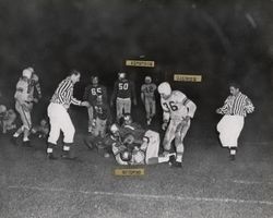 Run play during Petaluma Leghorns game against San Jose