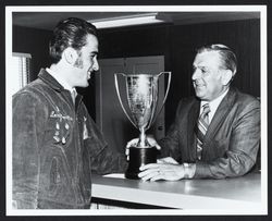 Larry Poncelta receiving a Future Farmers trophy