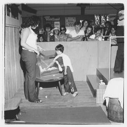 Raffle drawing in the Bank of Marin booth at the Sonoma-Marin Fair, Petaluma, California, 1978